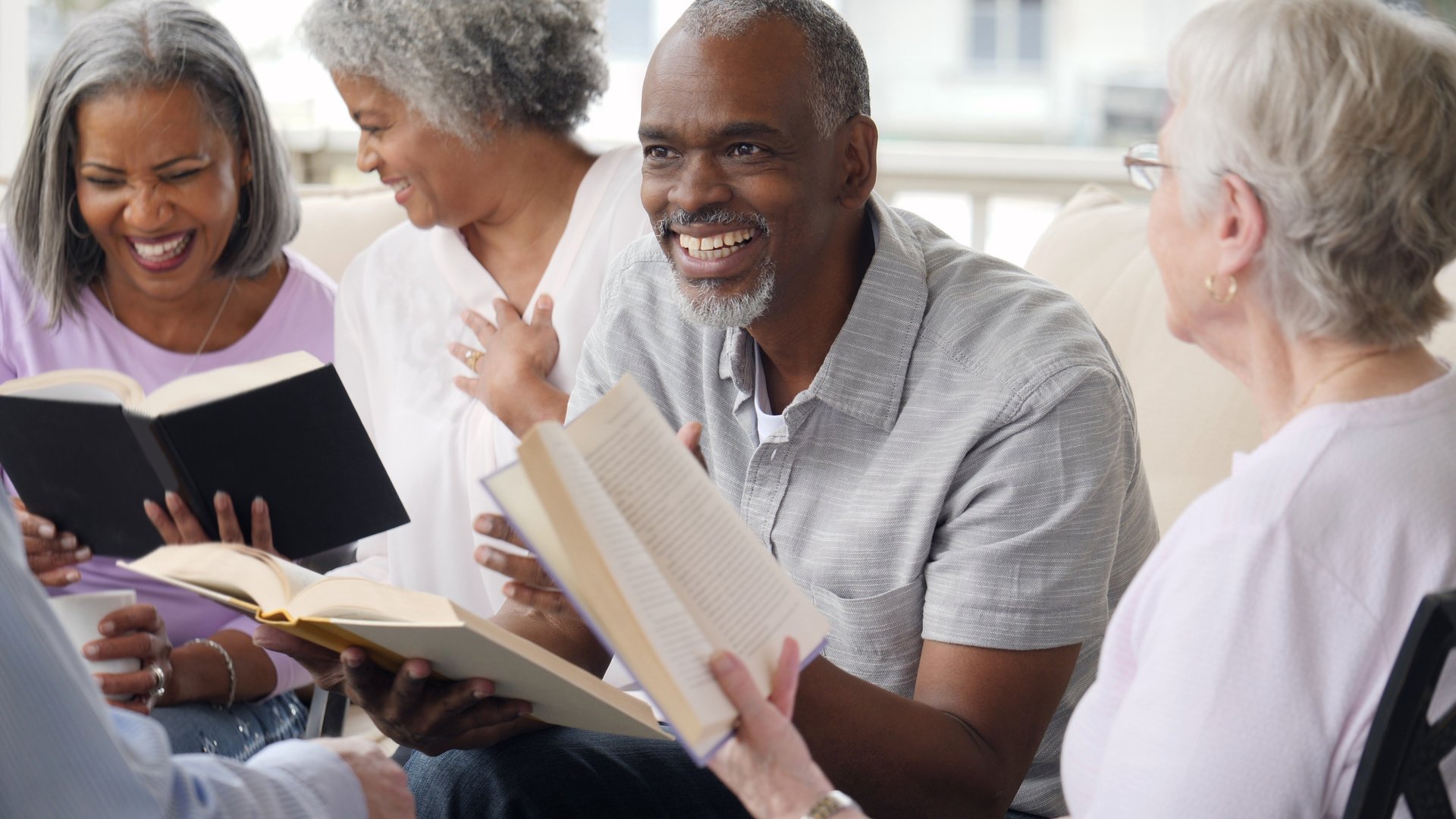 Senior man leads Bible study in retirement community